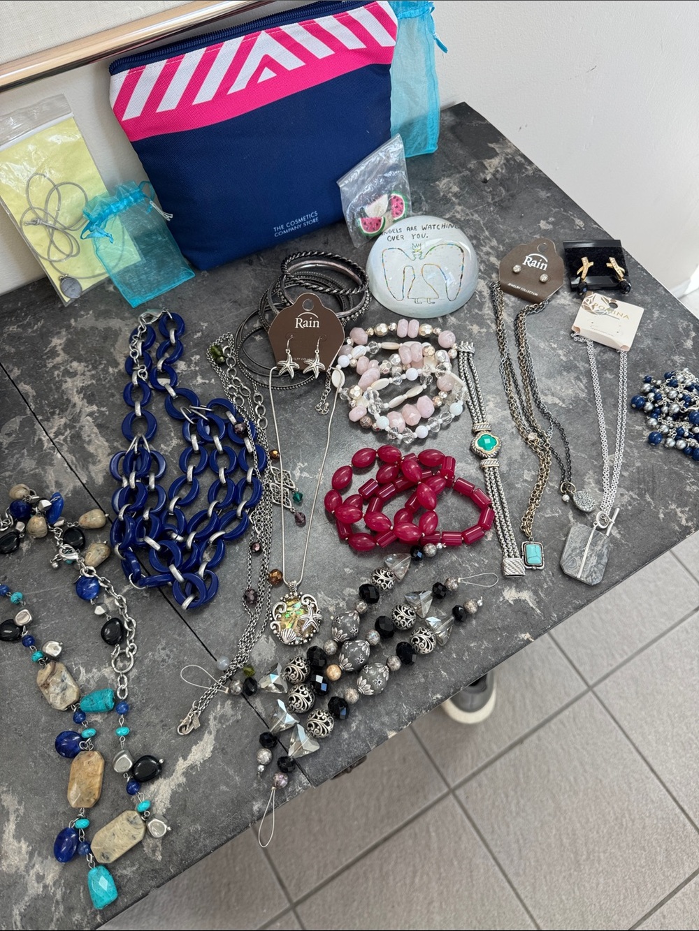 Bag full of fun jewelry—necklaces, bracelets, earrings